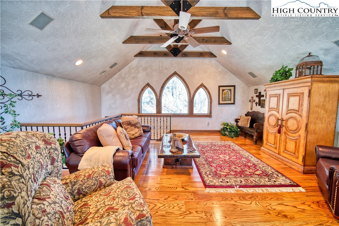 530 Howards Knob Road Boone, NC 28607 - Photo 28 of 49 a living room with fireplace furniture and a rug