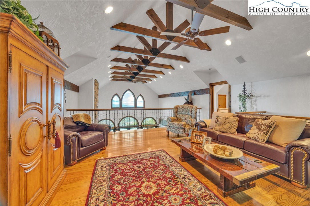 530 Howards Knob Road Boone, NC 28607 - Photo 29 of 49 a living room with furniture a rug and white walls