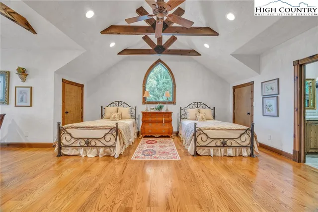 a view of a a dining room with furniture window and wooden floor