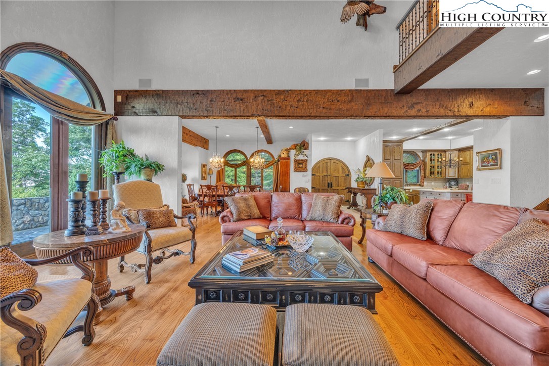 530 Howards Knob Road Boone, NC 28607 - Photo 4 of 49 a living room with fireplace furniture and a large window
