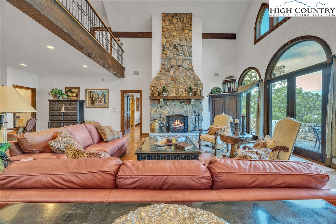 530 Howards Knob Road Boone, NC 28607 - Photo 5 of 49 a living room with furniture fireplace and a large window