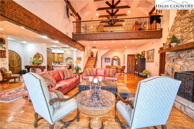 a kitchen with a sink a stove cabinets and a clock