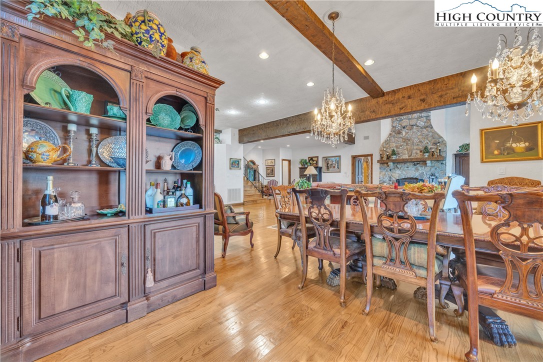 530 Howards Knob Road Boone, NC 28607 - Photo 10 of 49 a view of a dining room with furniture and chandelier