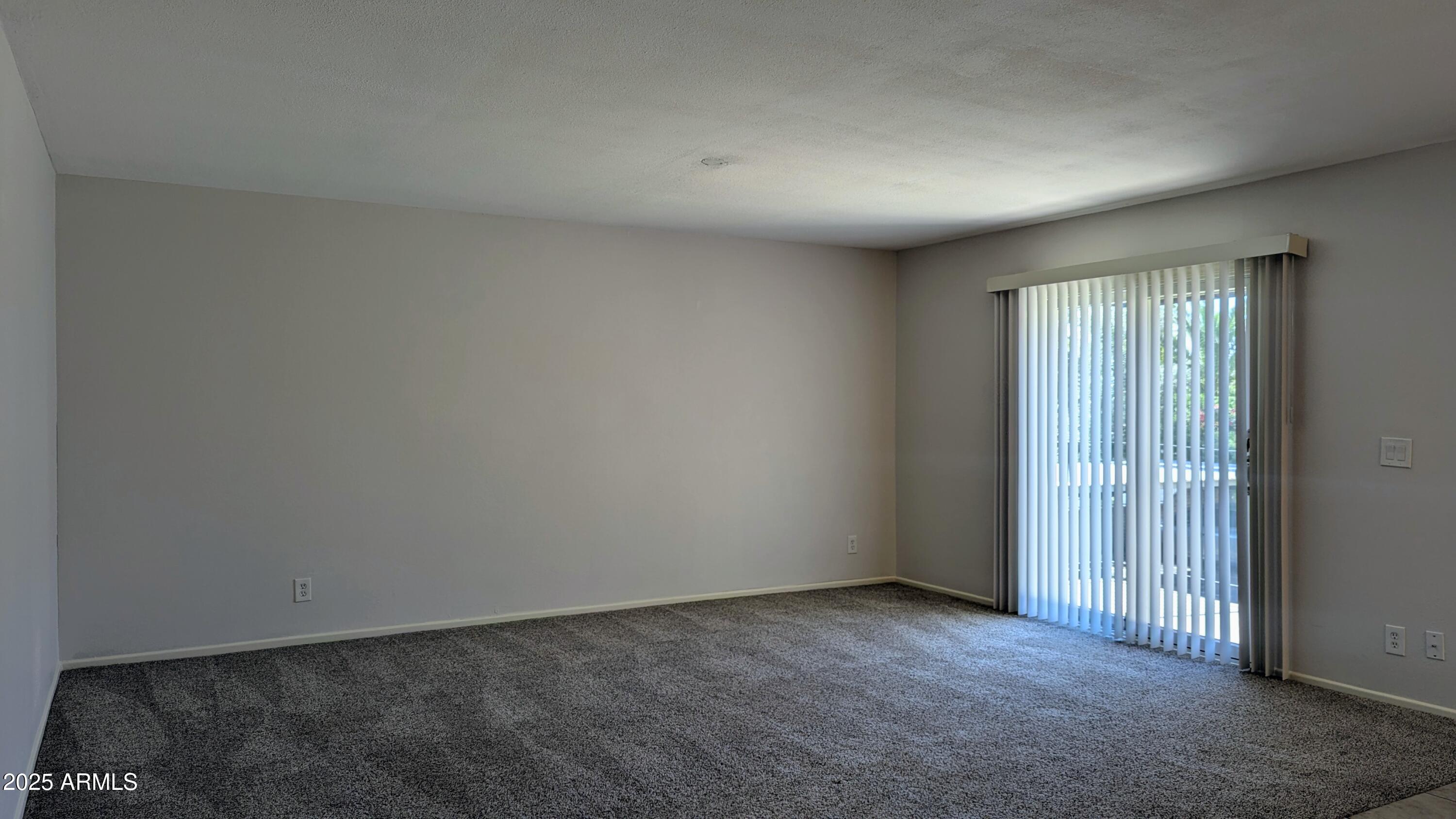 2228 East Campbell Avenue, Unit 234 Phoenix, AZ 85016 - Photo 12 of 18 an empty room with windows