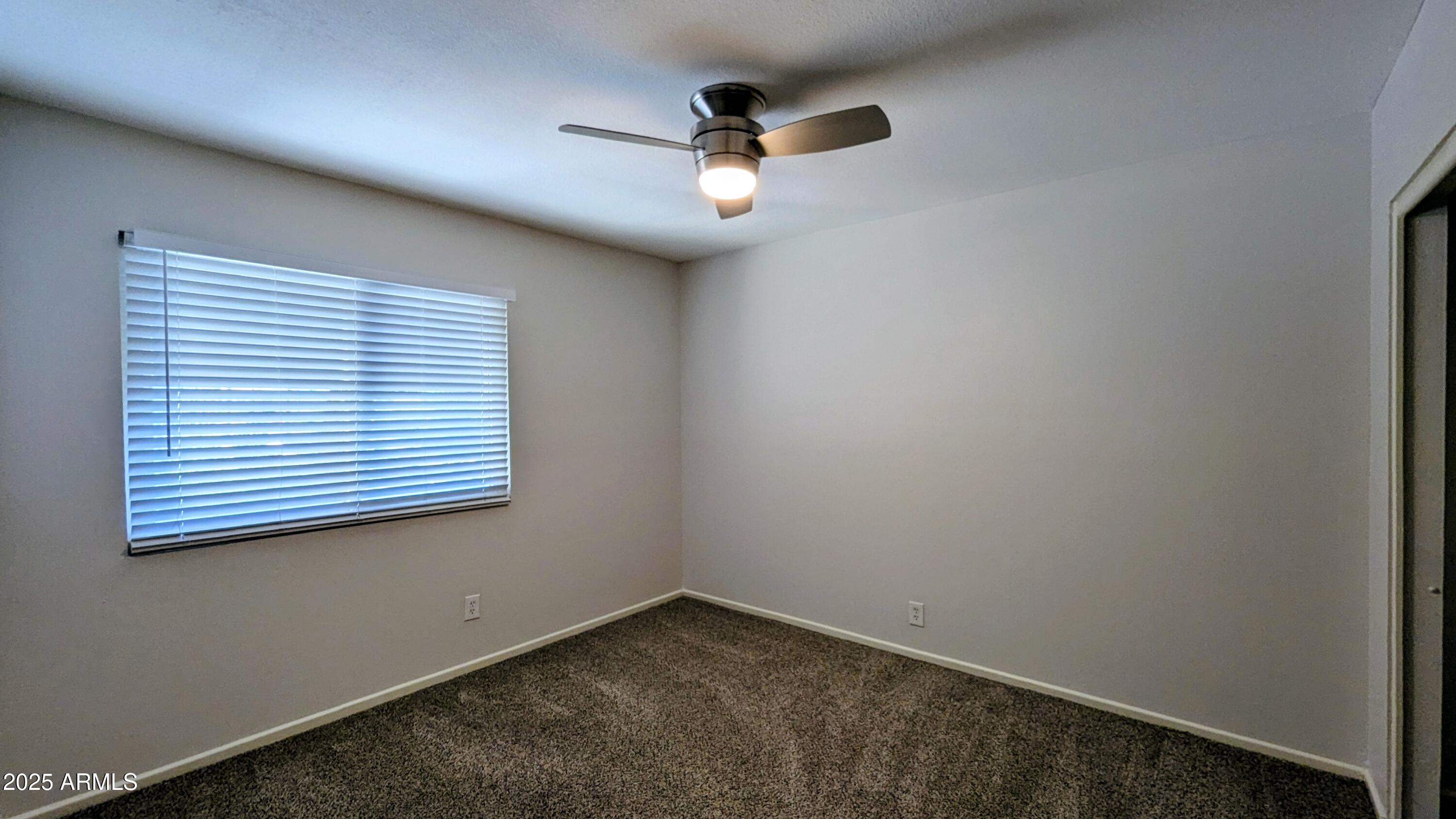 2228 East Campbell Avenue, Unit 234 Phoenix, AZ 85016 - Photo 18 of 18 an empty room with a window