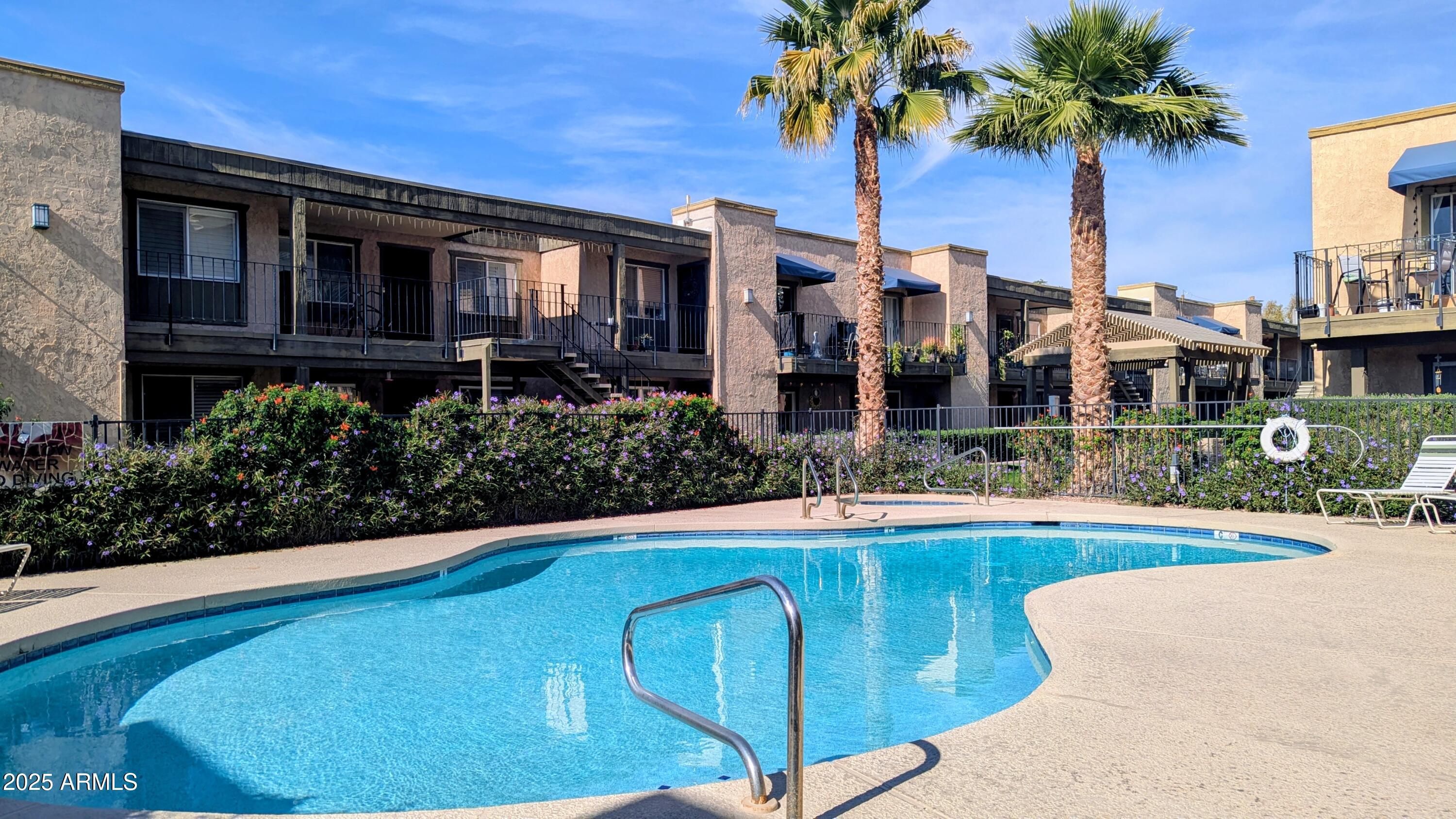 2228 East Campbell Avenue, Unit 234 Phoenix, AZ 85016 - Photo 3 of 18 a view of a house with swimming pool and porch