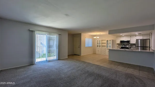 a view of a kitchen with a sink and cabinets