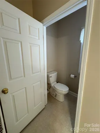a white toilet sitting next to a sink