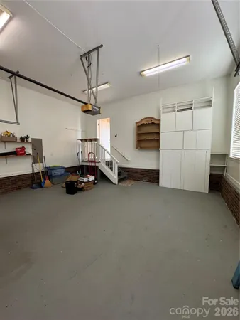 a view of a storage & utility room with two washing machine
