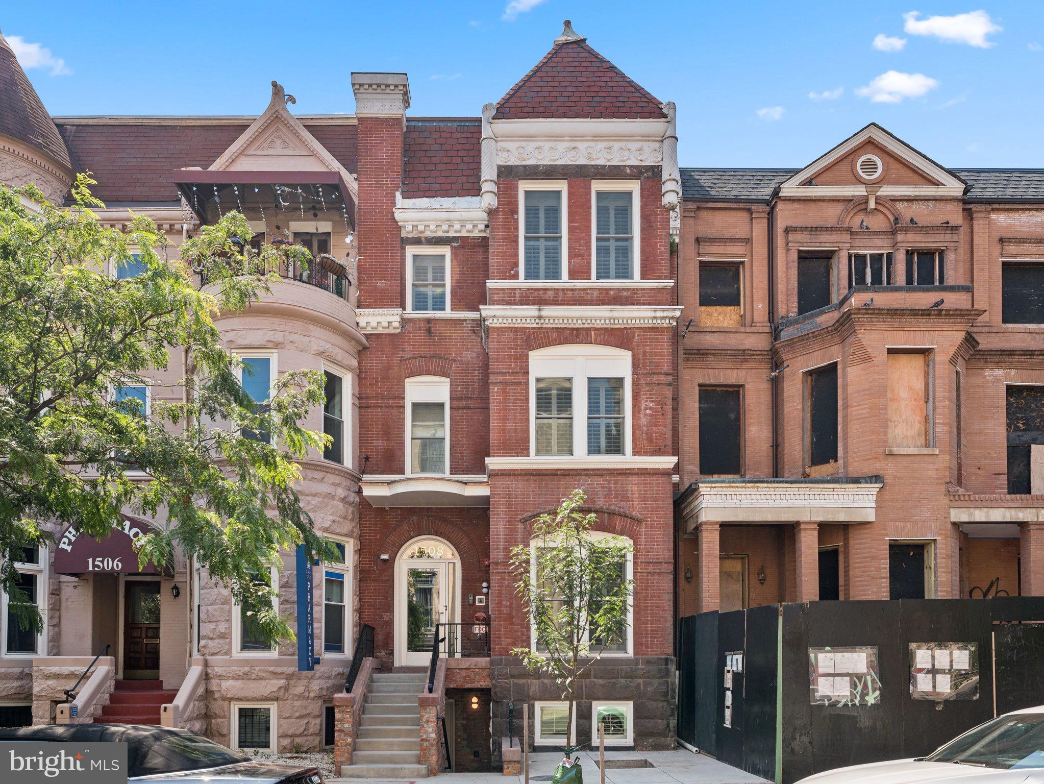 1508 21st Street Northwest, Unit 1 Washington, DC 20036 - Photo 1 of 40 front view of a brick house with a large windows