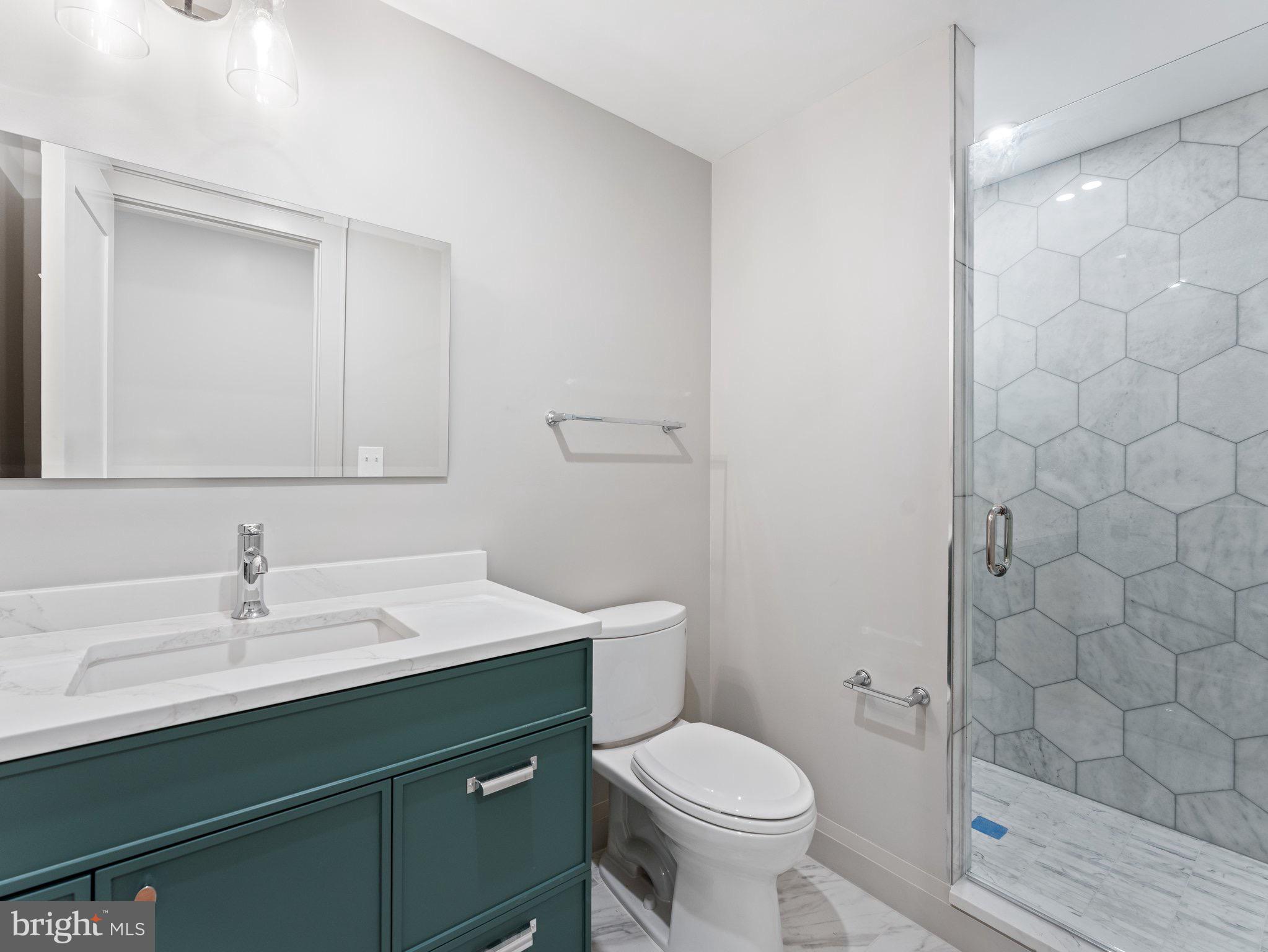 1508 21st Street Northwest, Unit 1 Washington, DC 20036 - Photo 16 of 40 a bathroom with a sink toilet and shower