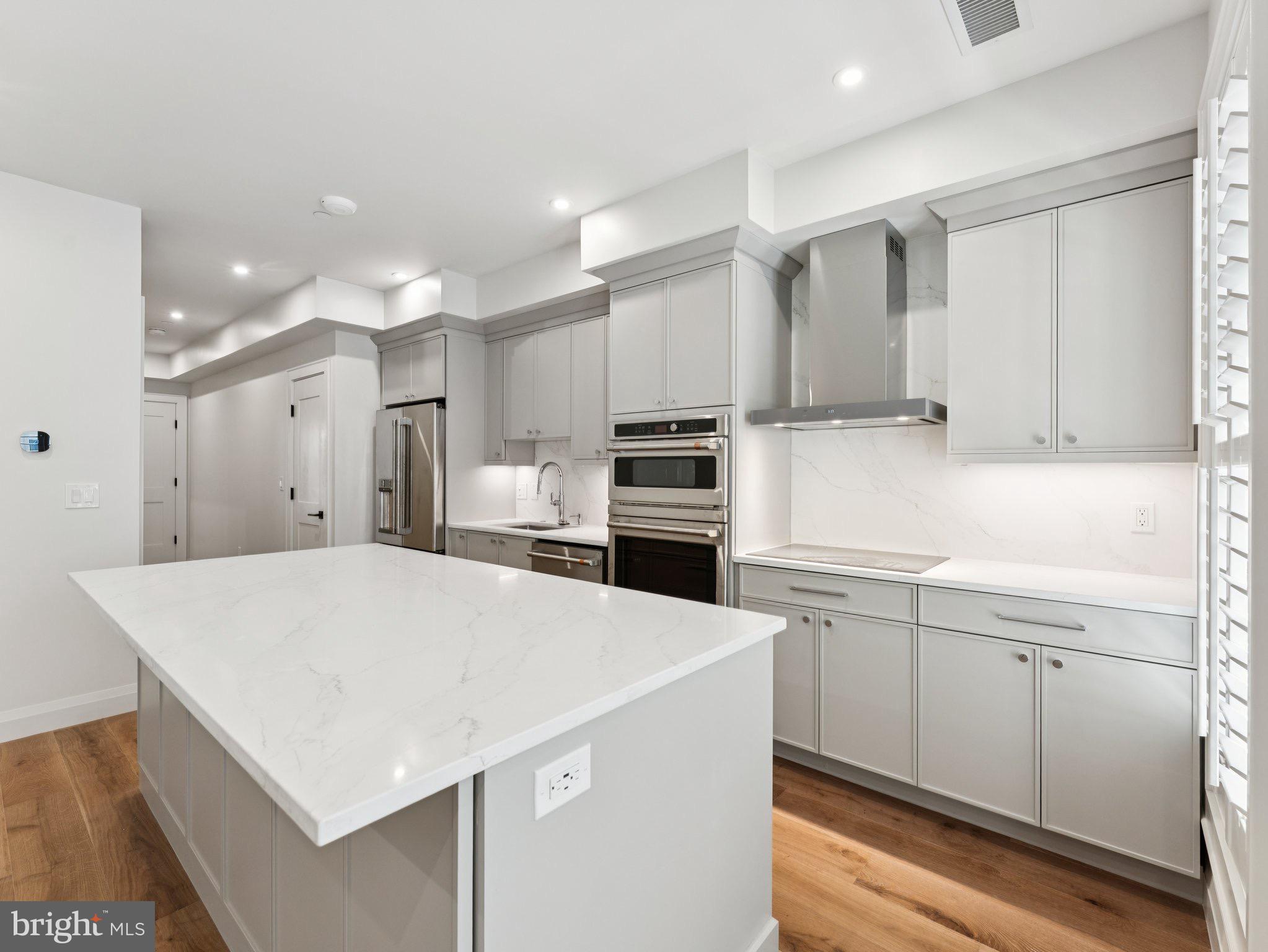 1508 21st Street Northwest, Unit 1 Washington, DC 20036 - Photo 20 of 40 a kitchen with a sink a stove and refrigerator