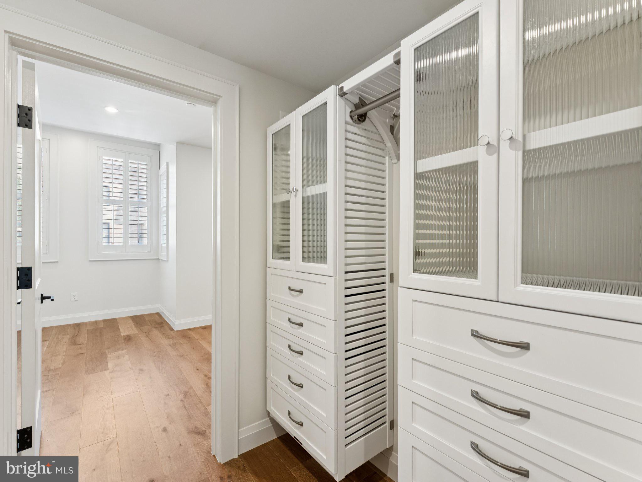 1508 21st Street Northwest, Unit 1 Washington, DC 20036 - Photo 34 of 40 front view of a bedroom with cabinet