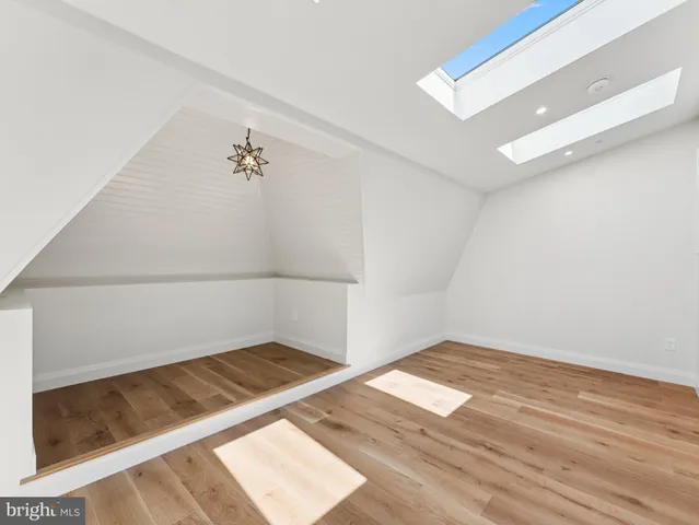 an empty room with wooden floor