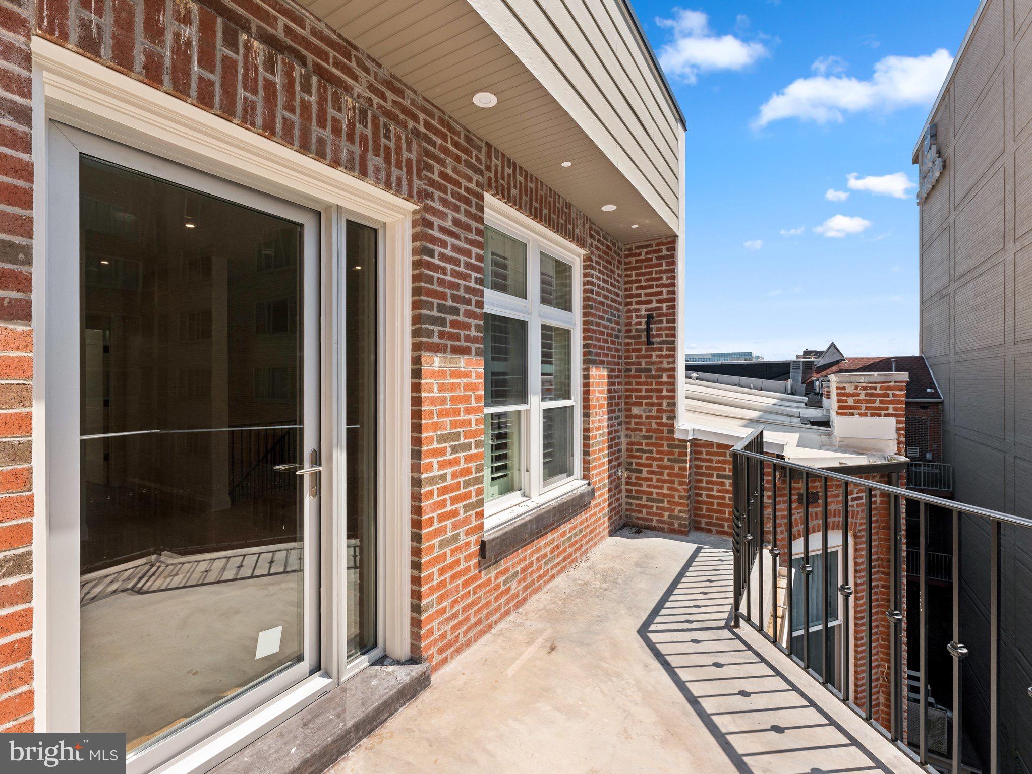 1508 21st Street Northwest, Unit 1 Washington, DC 20036 - Photo 38 of 40 a view of balcony with floor to ceiling windows and outdoor view