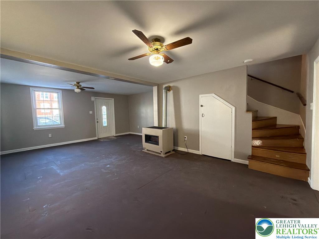 934 Butler Street Easton, PA 18042 - Photo 5 of 14 a view of a livingroom with a ceiling fan and window