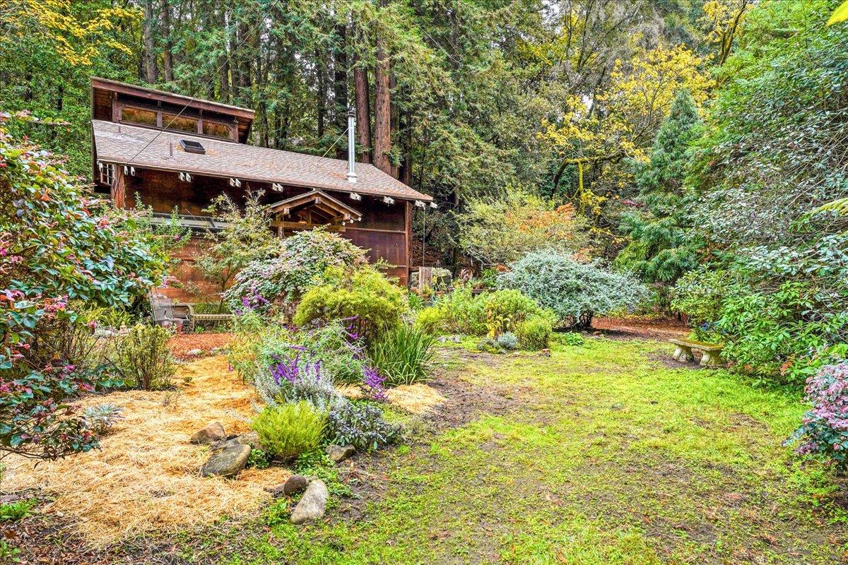 732 Eureka Canyon Road Watsonville, CA 95076 - Photo 2 of 28 a house is sitting in middle of forest