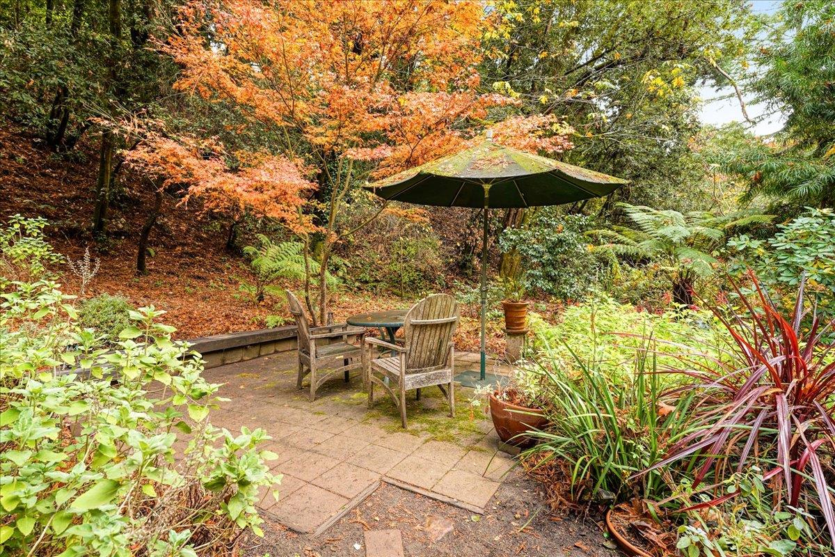 732 Eureka Canyon Road Watsonville, CA 95076 - Photo 23 of 28 a view of a table and chairs under an umbrella