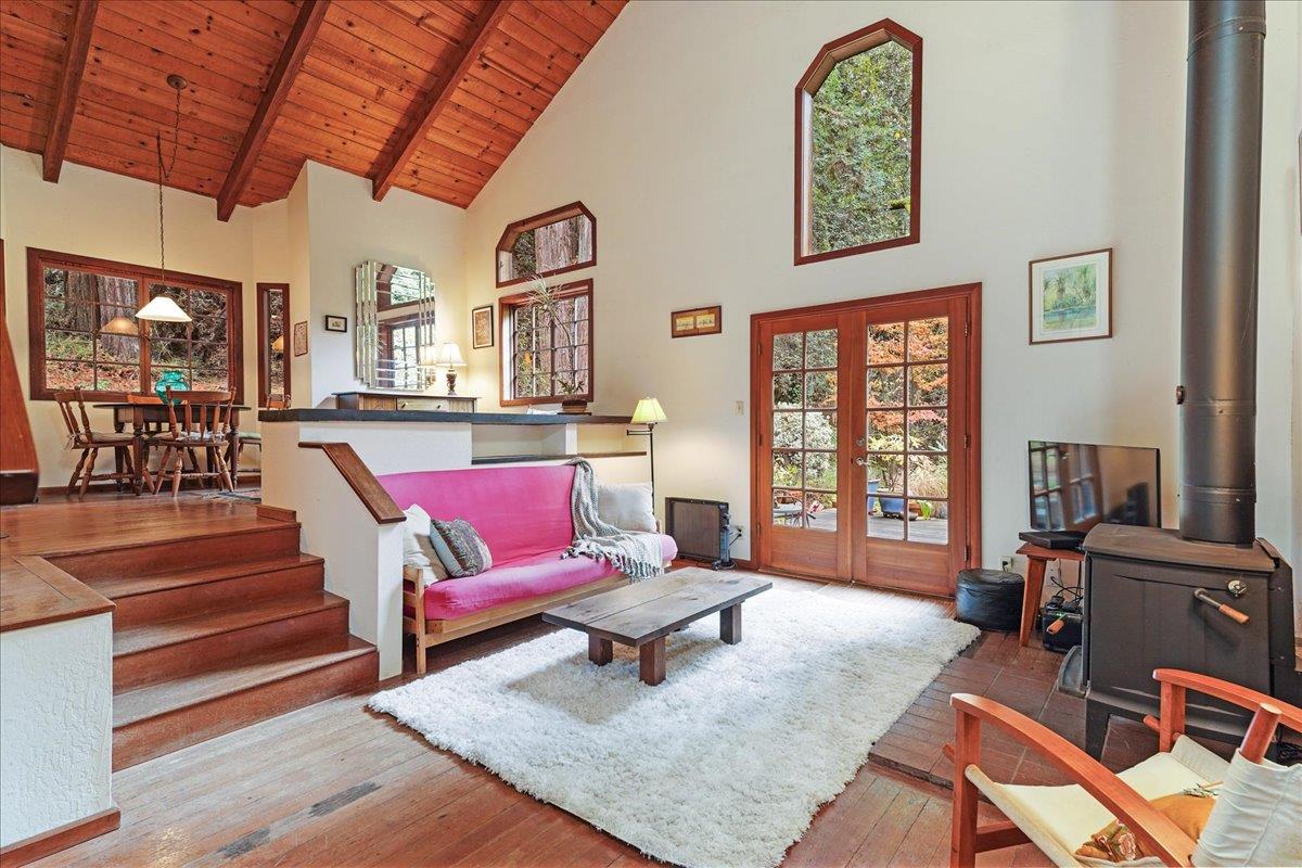 732 Eureka Canyon Road Watsonville, CA 95076 - Photo 4 of 28 a living room with furniture a flat screen tv and a large window