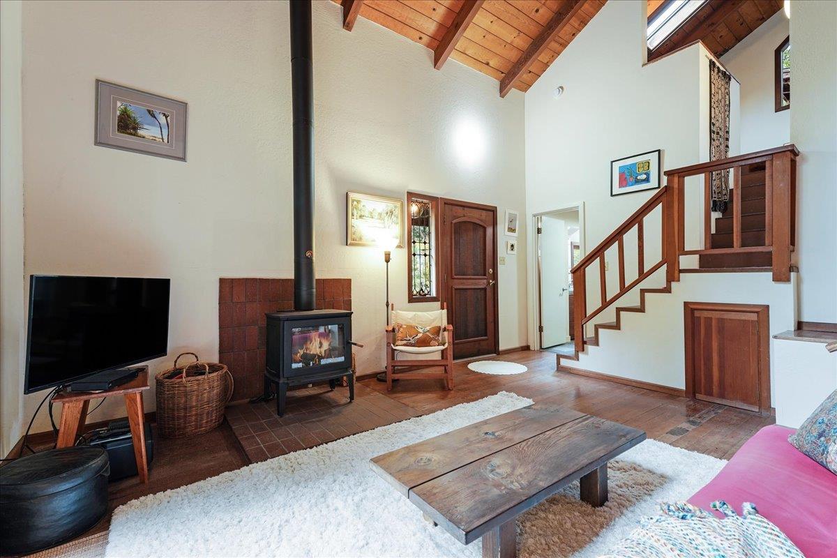 732 Eureka Canyon Road Watsonville, CA 95076 - Photo 6 of 28 a living room with furniture and a flat screen tv