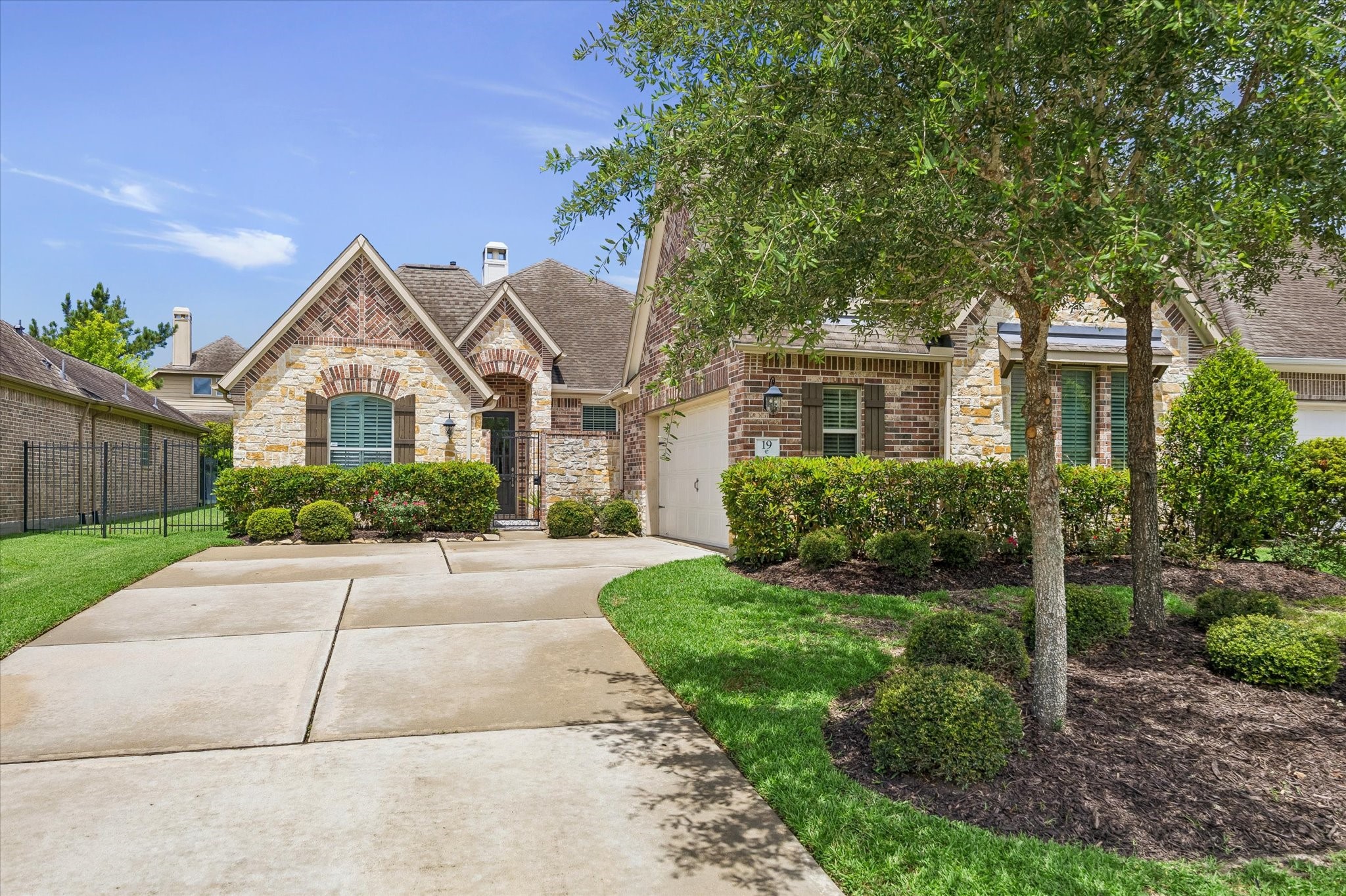 19 Peace Tree Way Tomball, TX 77375 - Photo 2 of 36 Brick and stone exterior with 3 car tandem garage