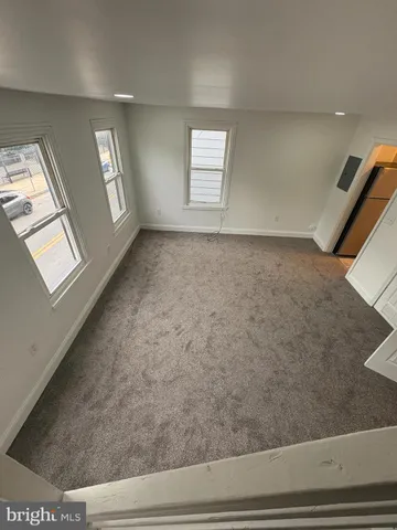 a white toilet sitting next to a bath tub