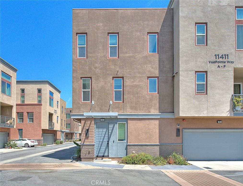 a front view of a building with a road
