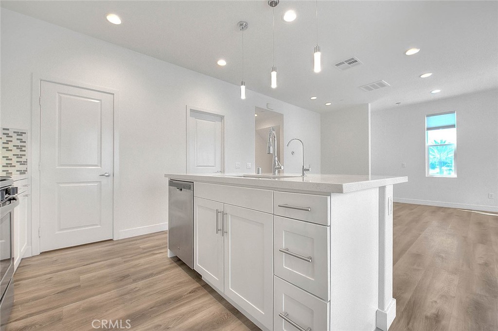 11411 VuePointe Way, Unit E El Monte, CA 91732 - Photo 16 of 38 a bathroom with a sink a mirror and a shower