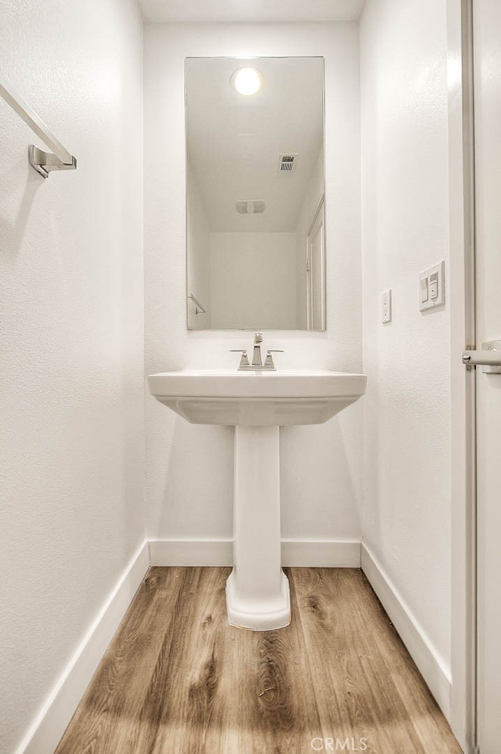 11411 VuePointe Way, Unit E El Monte, CA 91732 - Photo 19 of 38 a bathroom with a sink and a mirror