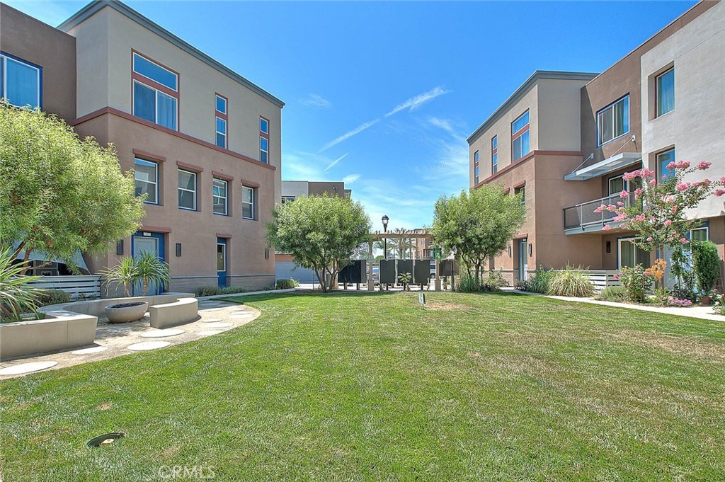 11411 VuePointe Way, Unit E El Monte, CA 91732 - Photo 37 of 38 a view of a building with a yard