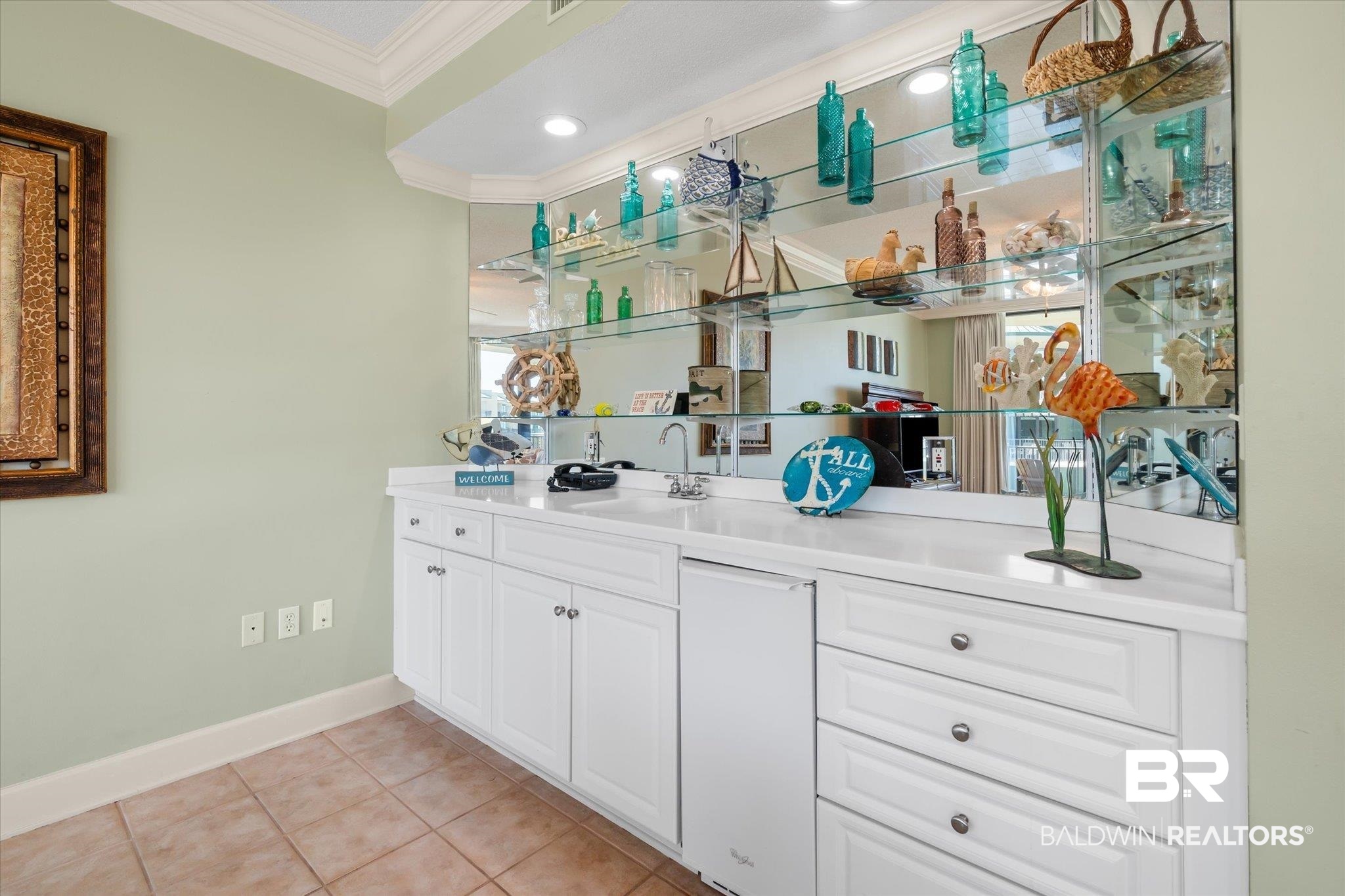 27580 Canal Road, Unit 1423 Orange Beach, AL 36561 - Photo 5 of 34 Bar featuring ice maker, sink, crown molding and recessed lighting.