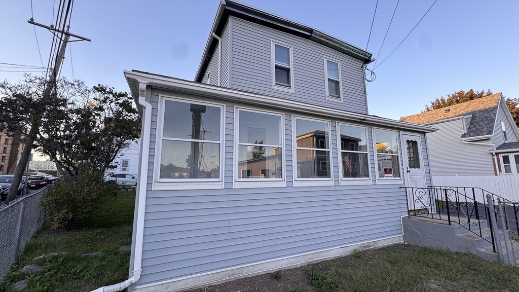 80 Jones Road Revere, MA 02151 - Photo 14 of 14 a front view of a house with a garden