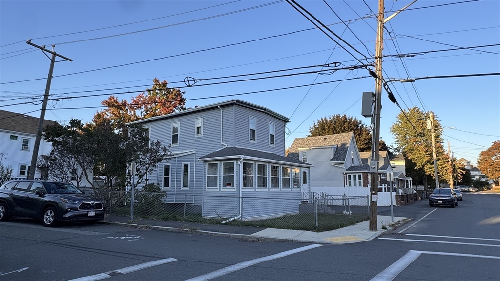 80 Jones Road Revere, MA 02151 - Photo 2 of 14 a view of a building and car parked on the road