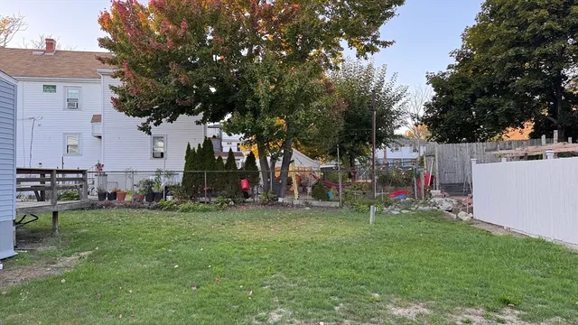 a view of a park with swings and a bench