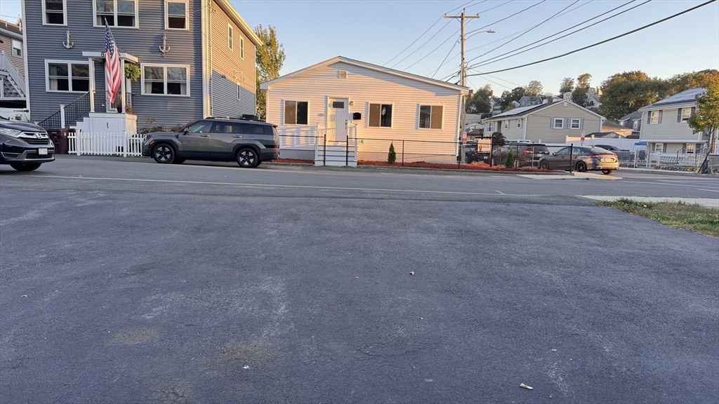 80 Jones Road Revere, MA 02151 - Photo 9 of 14 a view of a car park in front of a white house