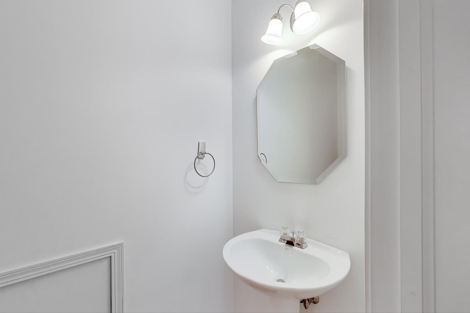 2271 Stoughton Circle Aurora, IL 60502 - Photo 13 of 34 a bathroom with a sink and a mirror