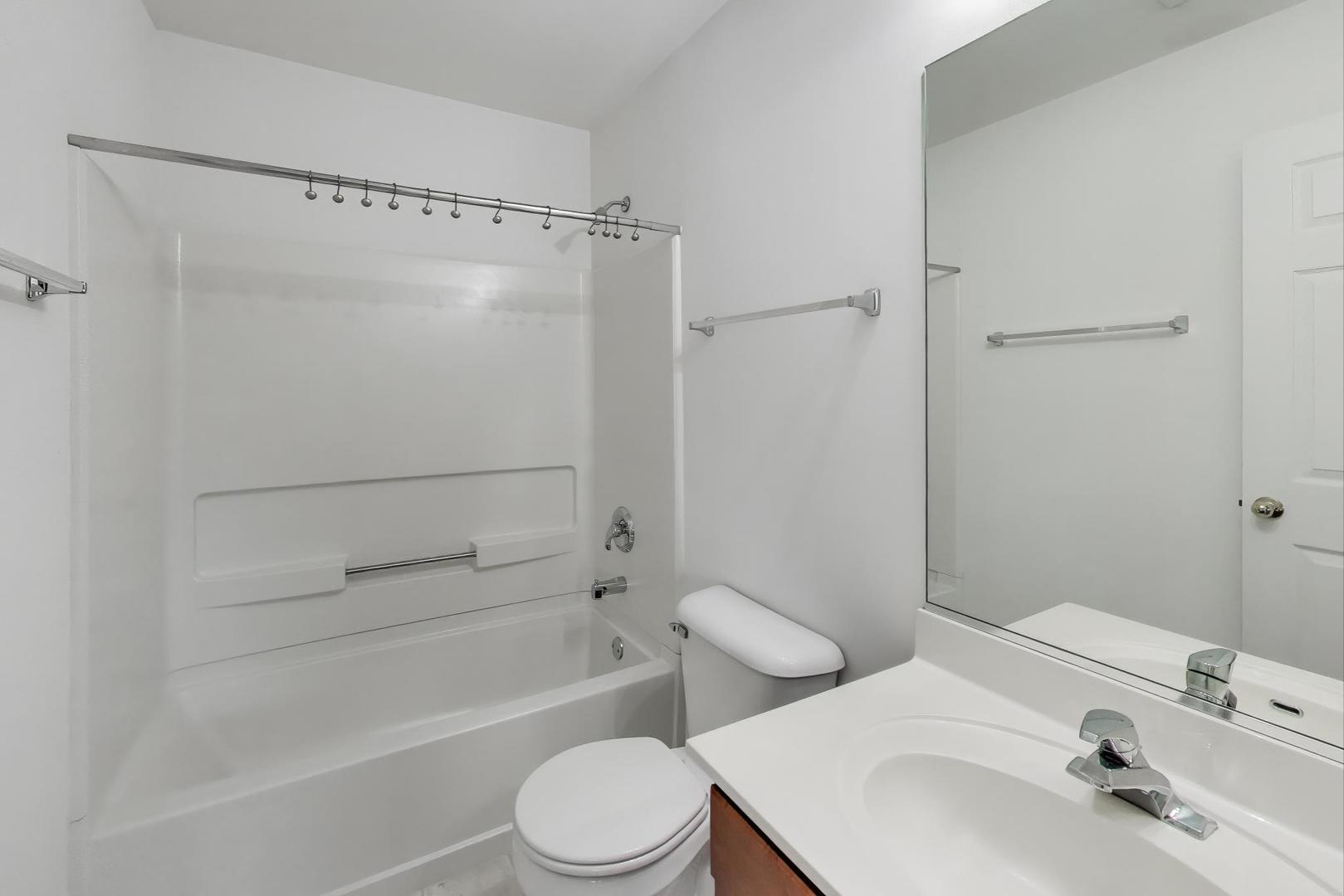 2271 Stoughton Circle Aurora, IL 60502 - Photo 16 of 34 a bathroom with a sink toilet and shower