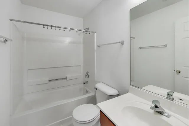 a view of an empty room with windows