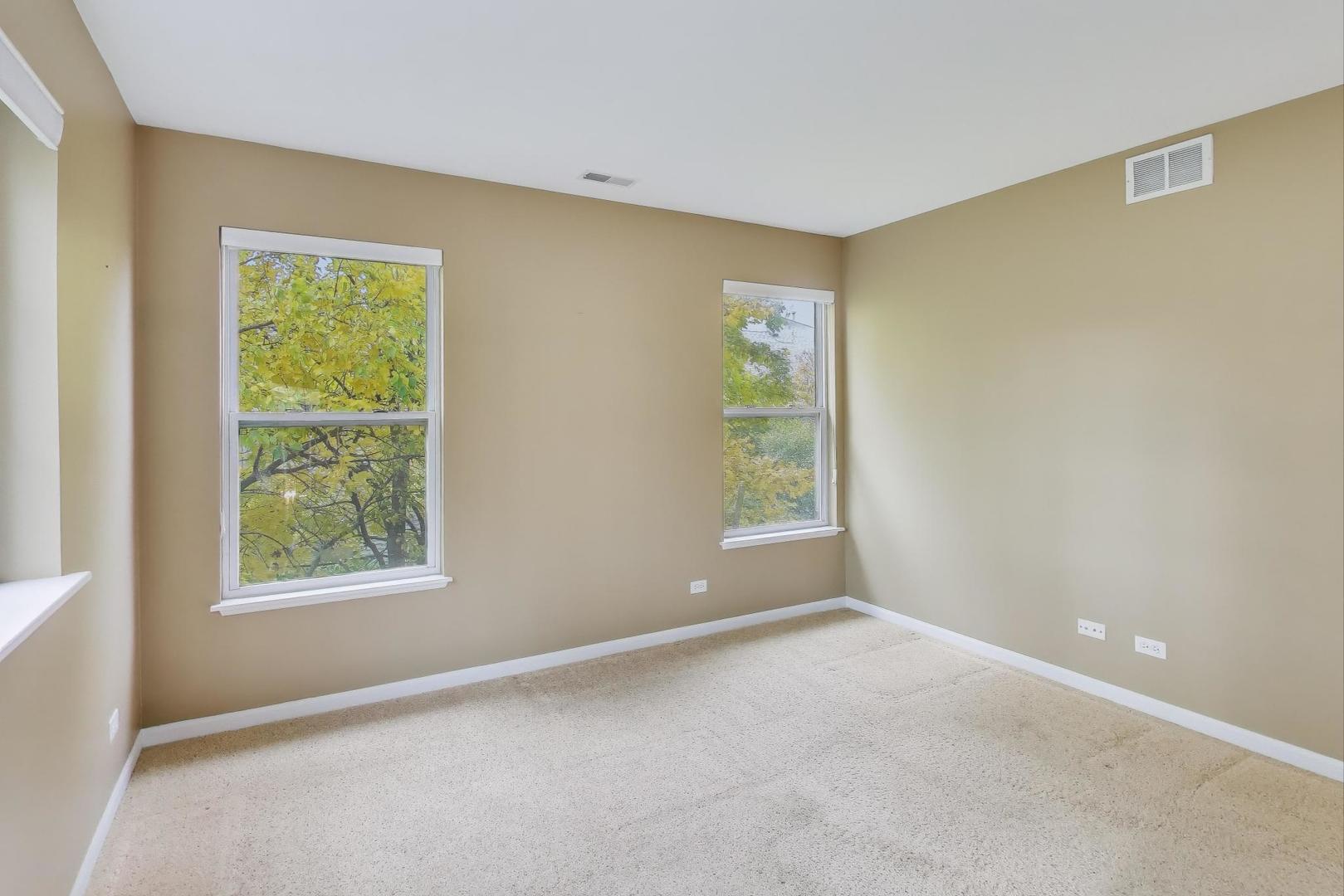2271 Stoughton Circle Aurora, IL 60502 - Photo 18 of 34 an empty room with windows