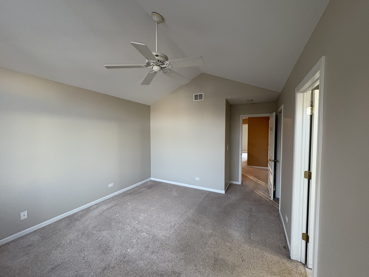 2271 Stoughton Circle Aurora, IL 60502 - Photo 21 of 34 a view of an empty room and a ceiling fan