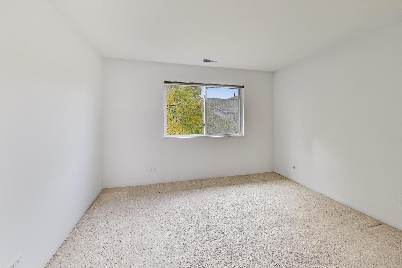 2271 Stoughton Circle Aurora, IL 60502 - Photo 25 of 34 an empty room with a window