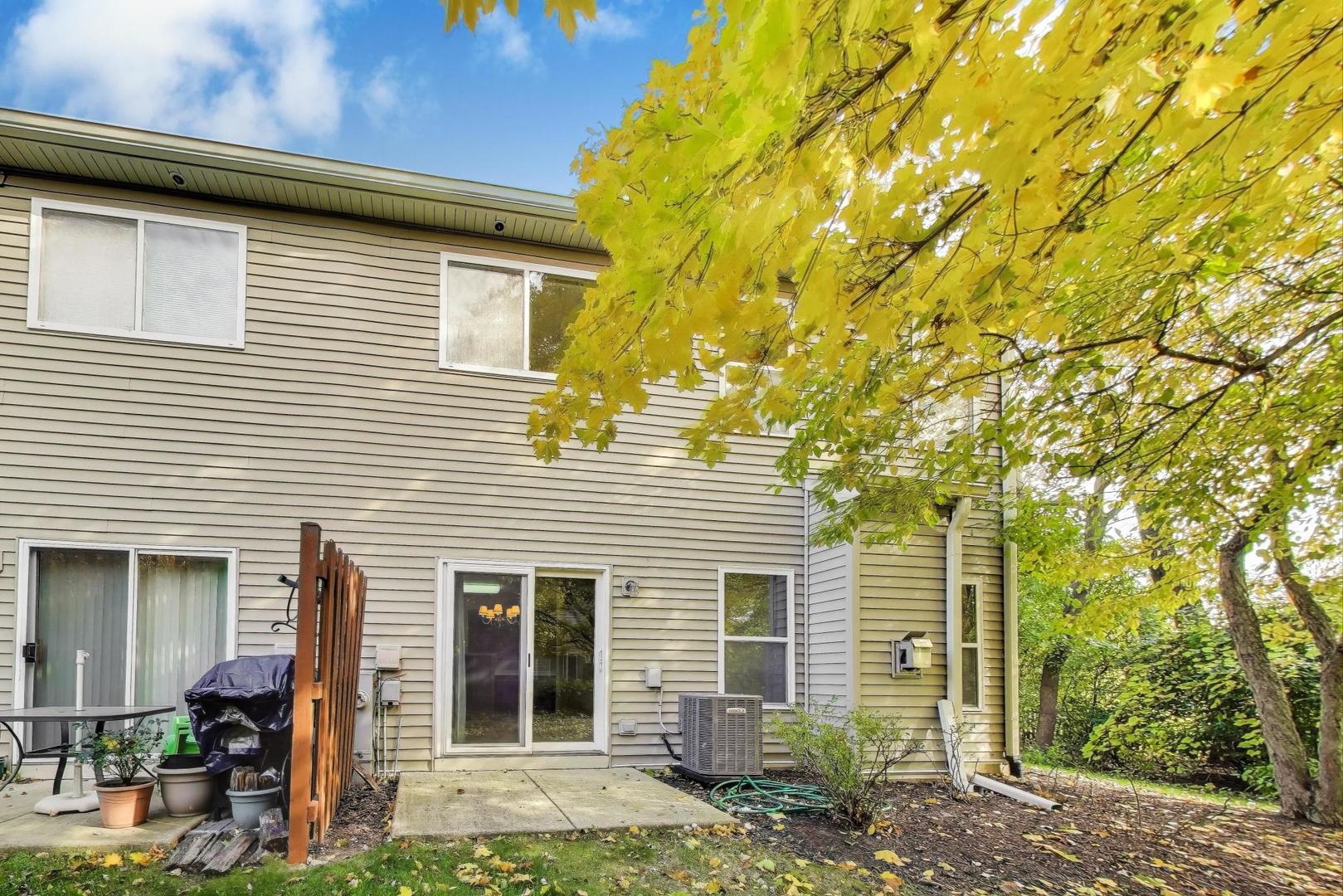 2271 Stoughton Circle Aurora, IL 60502 - Photo 29 of 34 a front view of a house with garden
