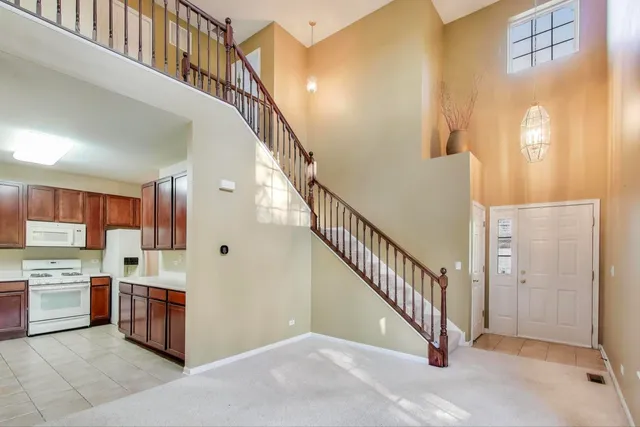 a view of a kitchen with furniture and staircase