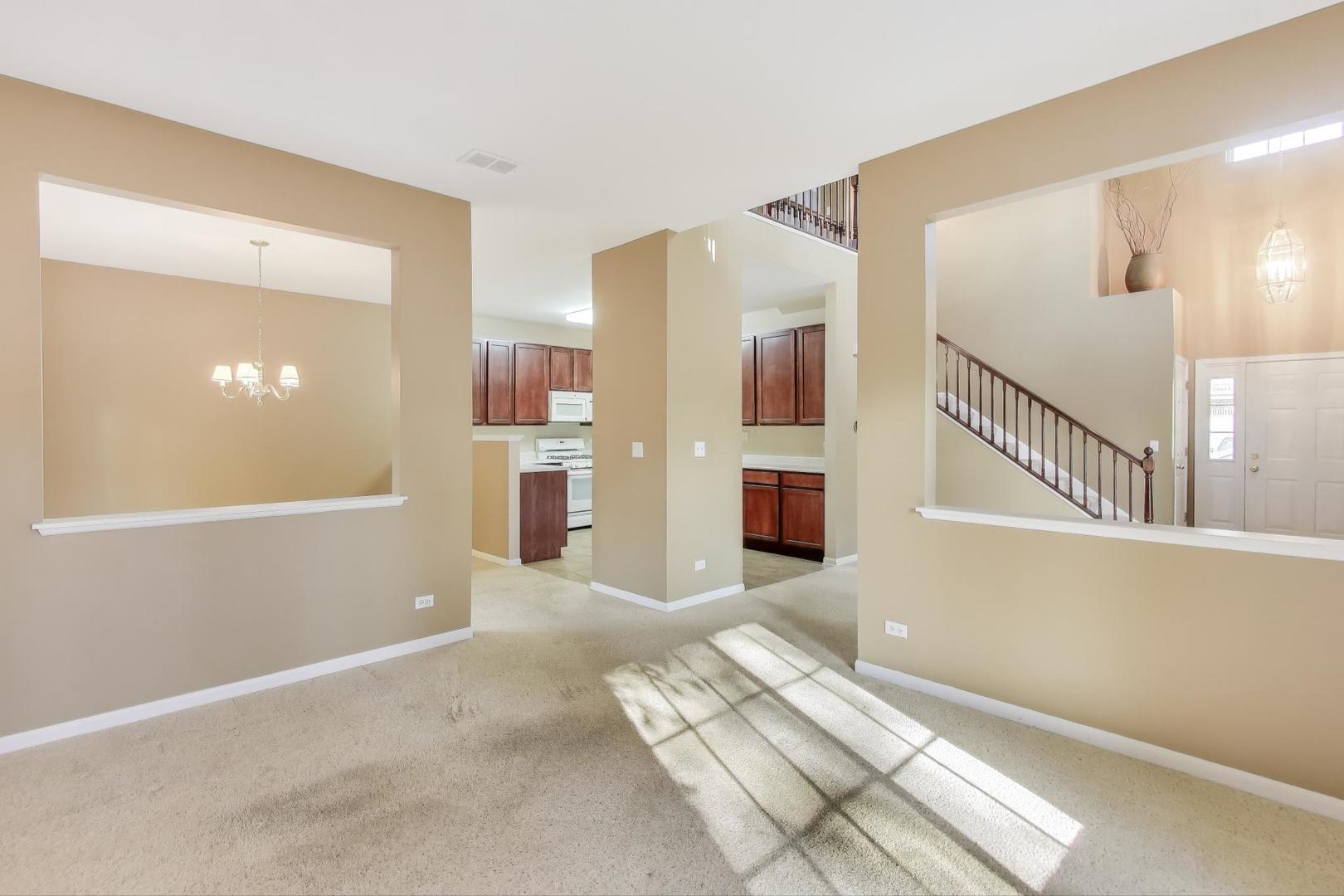 2271 Stoughton Circle Aurora, IL 60502 - Photo 10 of 34 a view of livingroom with furniture and stairs