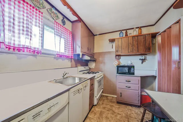 a kitchen with a stove and a refrigerator