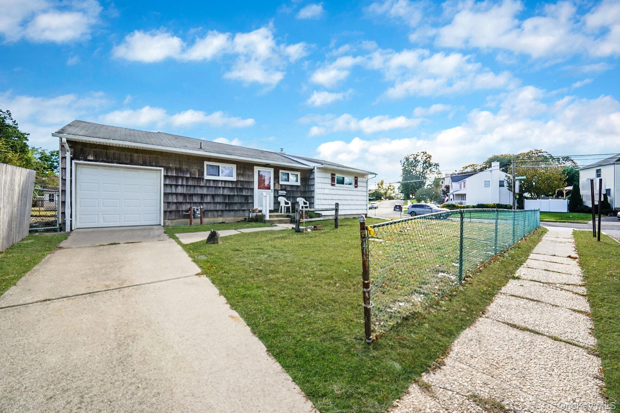 2 Sydney Street Plainview, NY 11803 - Photo 2 of 26 a house view with a garden space