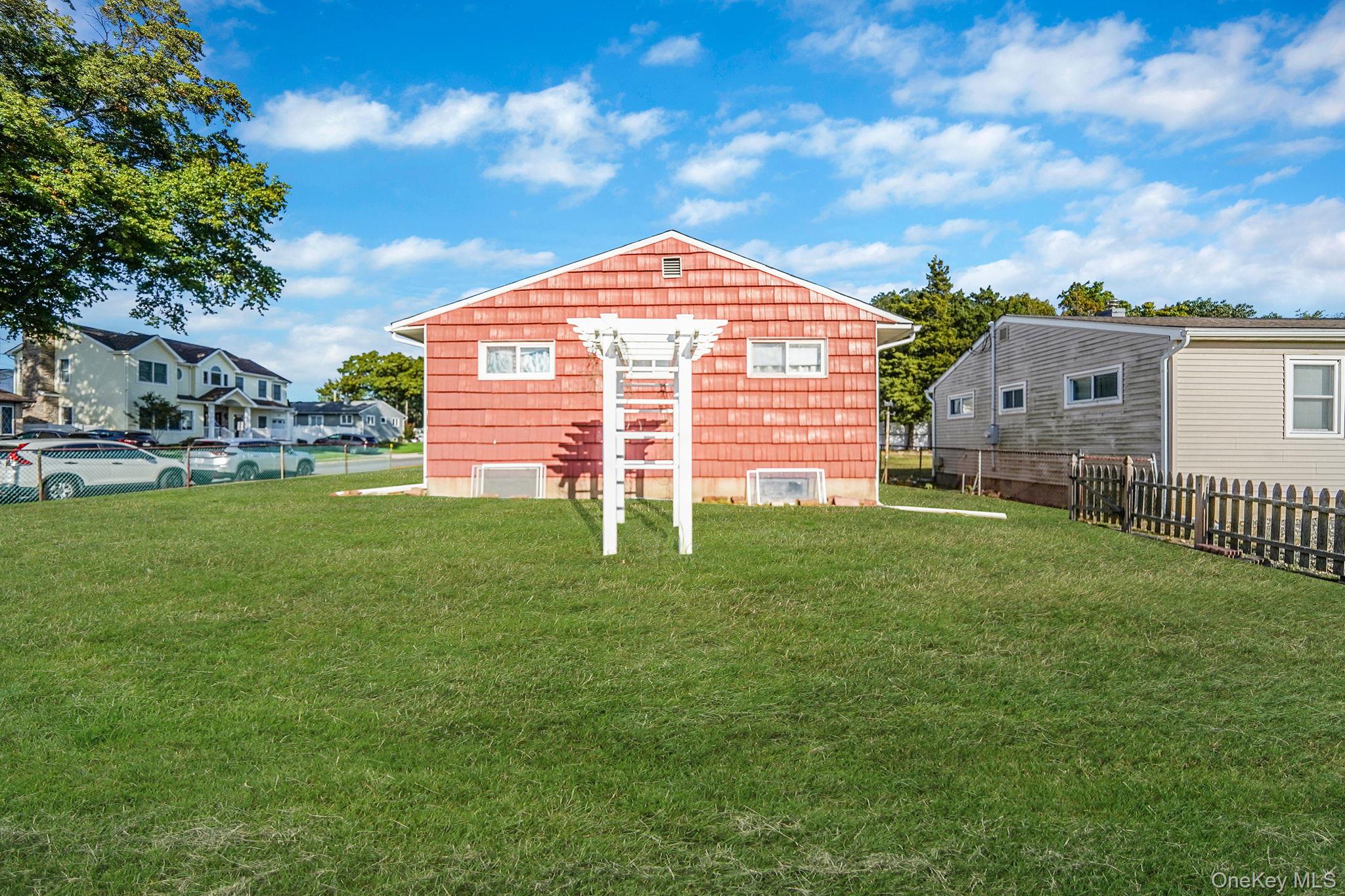 2 Sydney Street Plainview, NY 11803 - Photo 5 of 26 a view of a house with a backyard