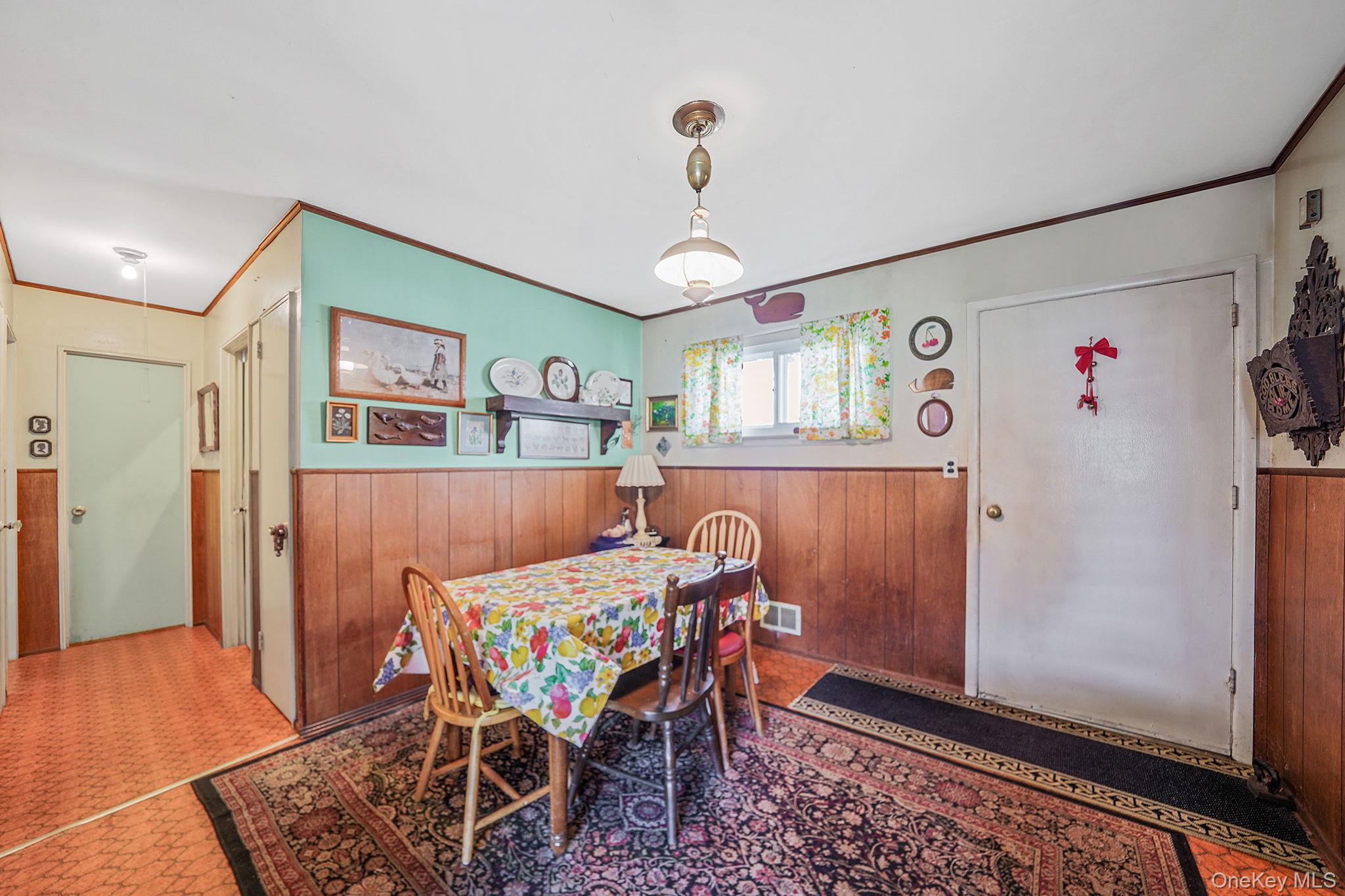 2 Sydney Street Plainview, NY 11803 - Photo 9 of 26 a view of a dining room with furniture and wooden floor