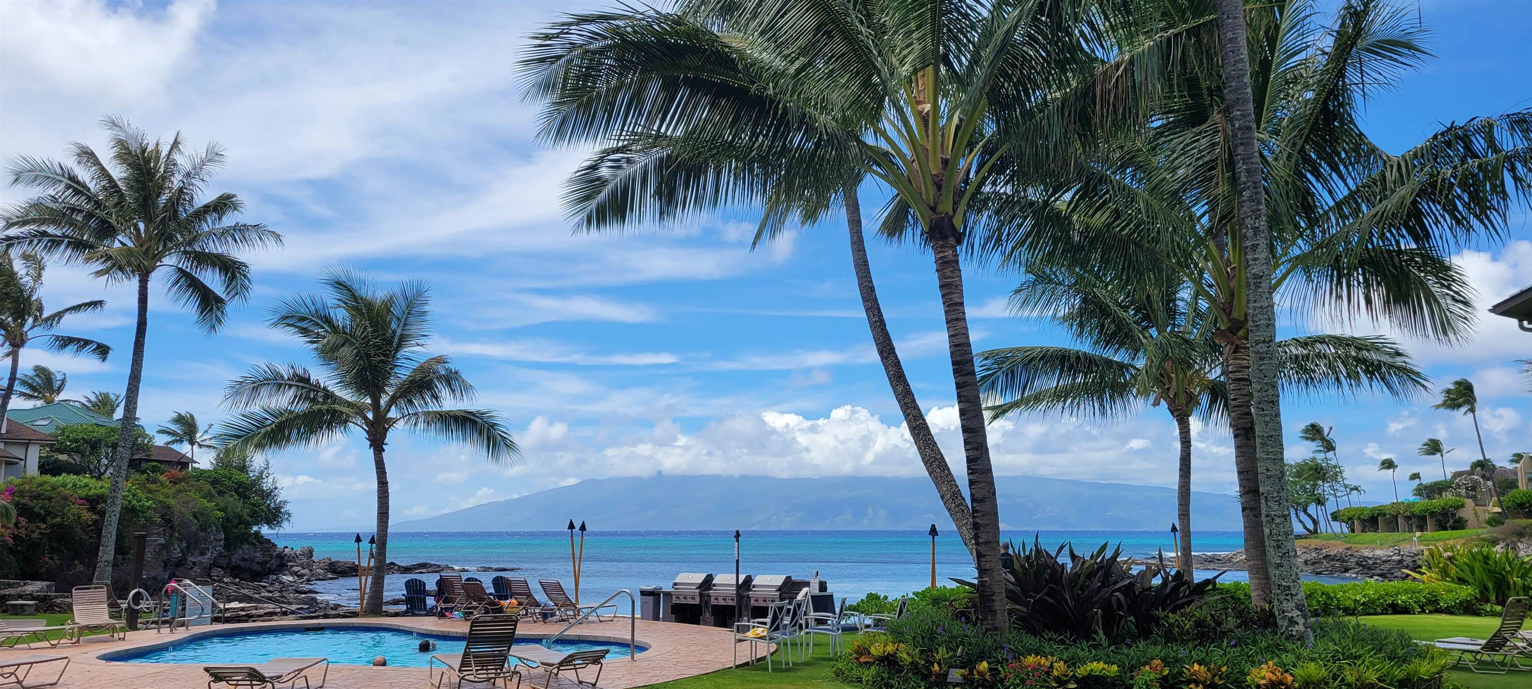 5255 Lower Honoapiilani Road, Unit 219 Lahaina, HI 96761 - Photo 11 of 12 a view of outdoor space with palm trees
