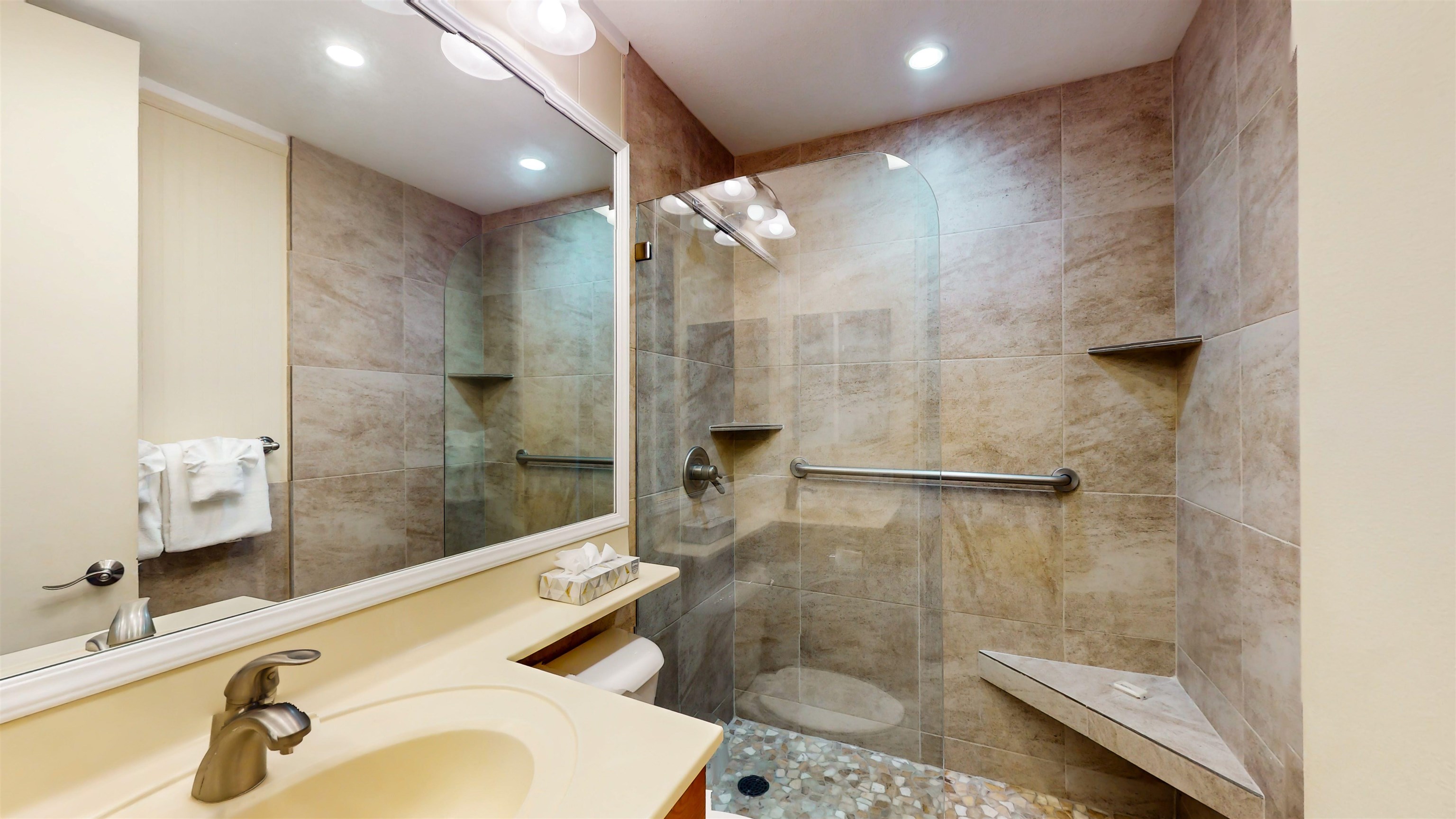 5255 Lower Honoapiilani Road, Unit 219 Lahaina, HI 96761 - Photo 4 of 12 a bathroom with a sink mirror toilet and shower